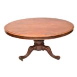 A Victorian mahogany oval tilt-top loo table on bulbous carved base with tripod cabriole legs, 72