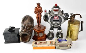 A collector's lot comprising a vintage brass spray gun, a WWI commemorative figure of a soldier, the