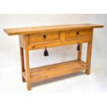 A pine hall table with a pair of drawers above undershelf, 76 x 135 x 34cm. Condition Report: From