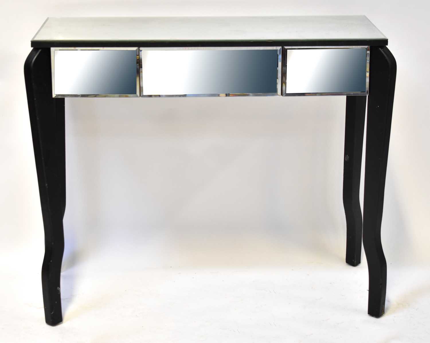 A mirrored side table with single drawer, to tapering supports, 81 x 95.5 x 45cm. Condition