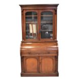 A Victorian mahogany bureau bookcase glazed top with cylinder top and fitted interior, slide-out