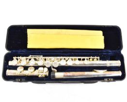 A three-piece silver plated 'Jazz' flute in chard case.