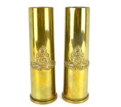 Two trench art vases or poker stands, made from artillery shell cases with applied regimental