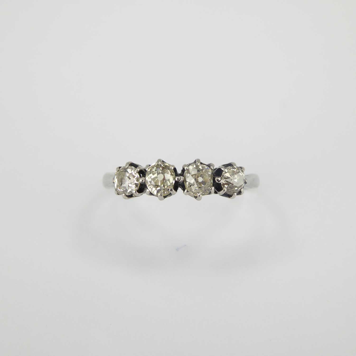 An 18ct white gold ring, the head set with four claw set rose cut diamonds with a slight tinge of - Image 2 of 3
