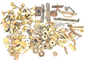 A quantity of door fittings, handles and vintage locks, to include brass examples.