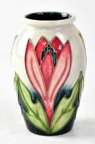 MOORCROFT; a small baluster vase decorated with crocuses, copyrighted for 1997, with impressed and