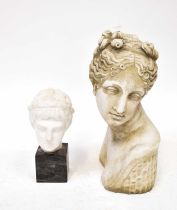 An alabaster bust of a Classical boy's head, mounted on grey marble base, overall height 28cm,