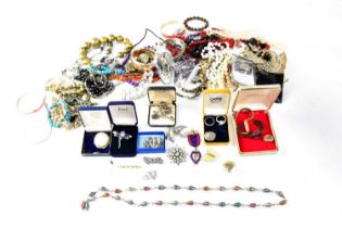A quantity of costume jewellery to include beaded necklaces, faux pearls, bangles, bracelets,