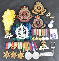 A WWII medal group, badges and ephemera relating to Stanley Briggs of the Lancashire Fusiliers,