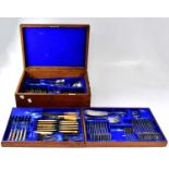 A 1930s Mappin & Webb oak canteen of 'Old English' pattern cutlery for twelve place settings, the