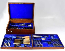 A 1930s Mappin & Webb oak canteen of 'Old English' pattern cutlery for twelve place settings, the