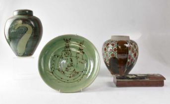 Three pieces of studio pottery two ginger jars of green ground with stylised swirl and leaf