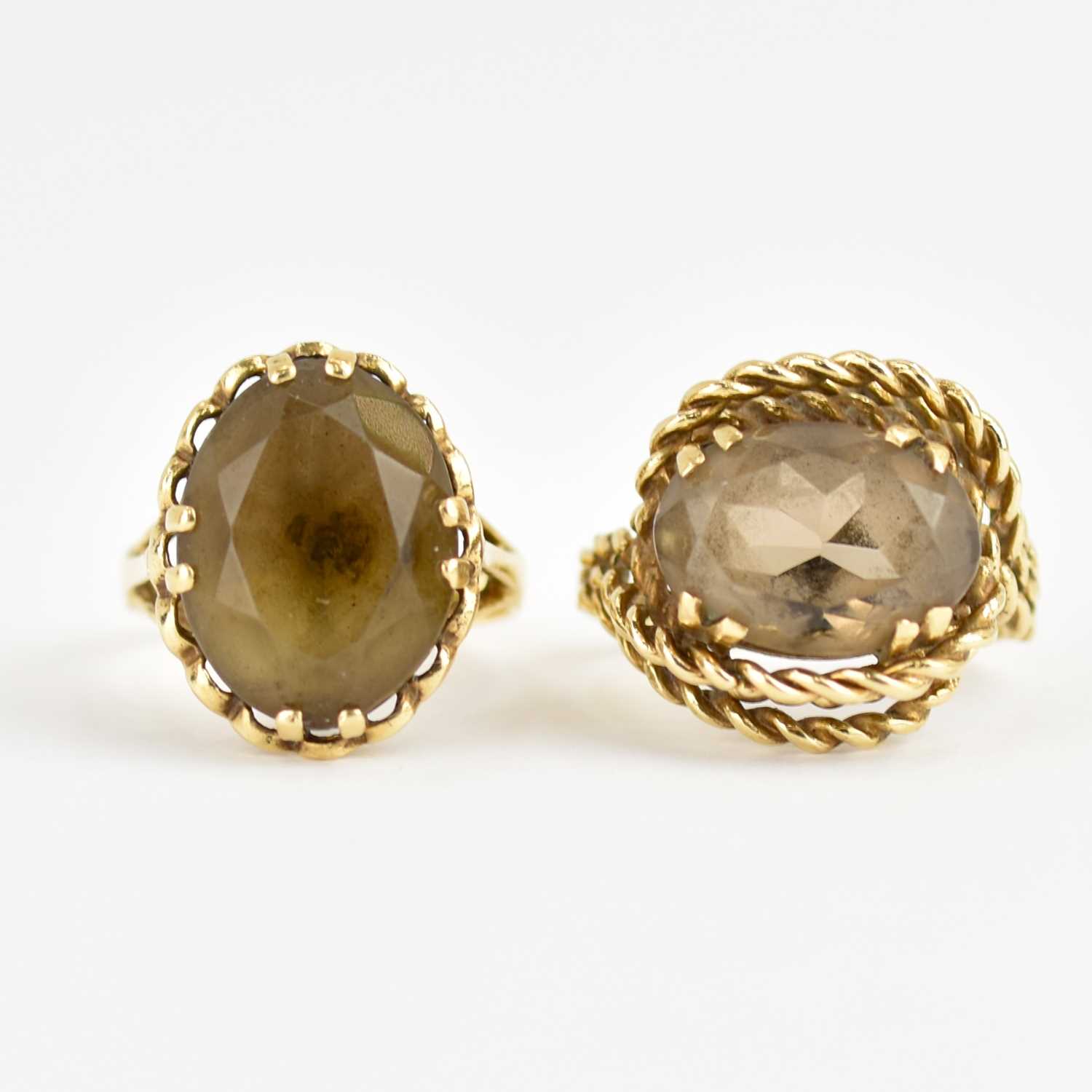 Two 9ct gold dress rings, both claw set with oval smoky quartz, one with rope twist mount, Size K - Image 2 of 3