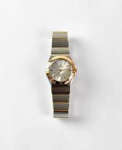 OMEGA; a ladies' 'Constellation' stainless steel and 18K gold wristwatch, the dial set with baton