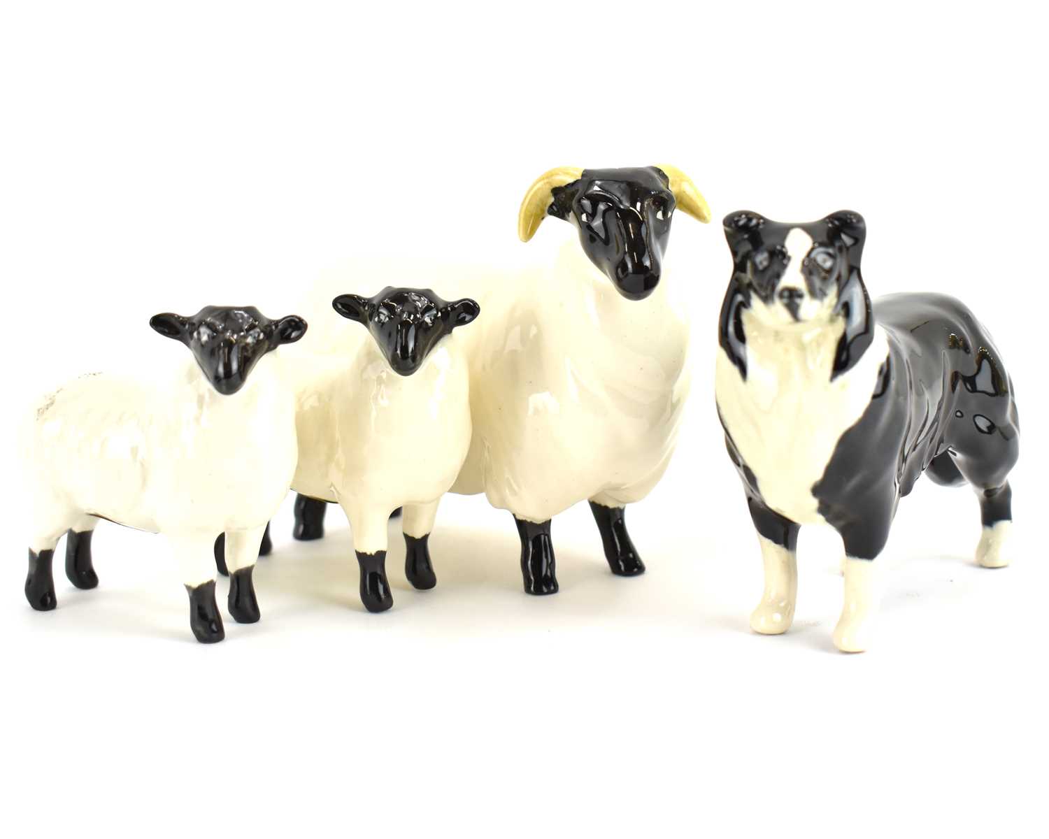 BESWICK; a Black Face Ram, two lambs and a Collie dog (4). Condition Report: - Good no noticeable