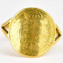 A 22ct gold ring set with a Victorian half sovereign, Jubilee head, shield back, split shoulders,