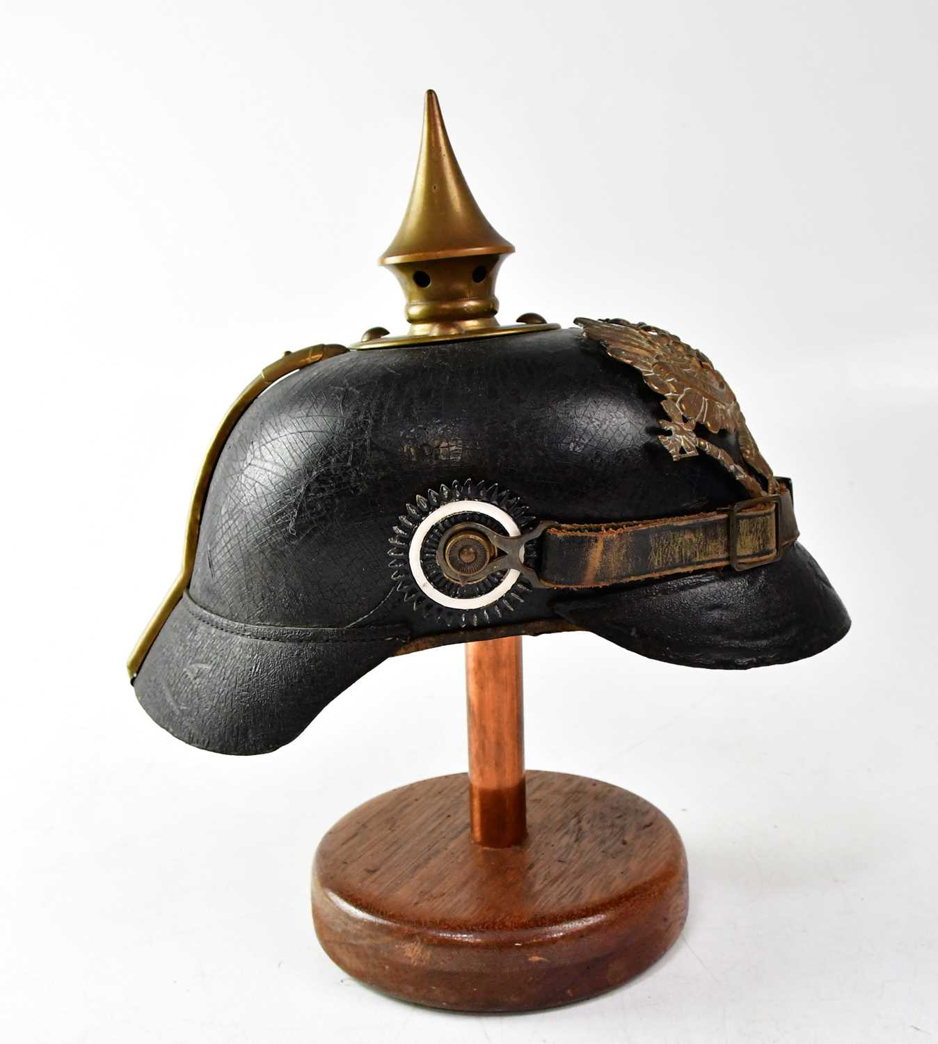 A WWI Prussian M1915 pickelhaube on stand (af). Condition Report: Leather cracking throughout, brass - Image 2 of 2