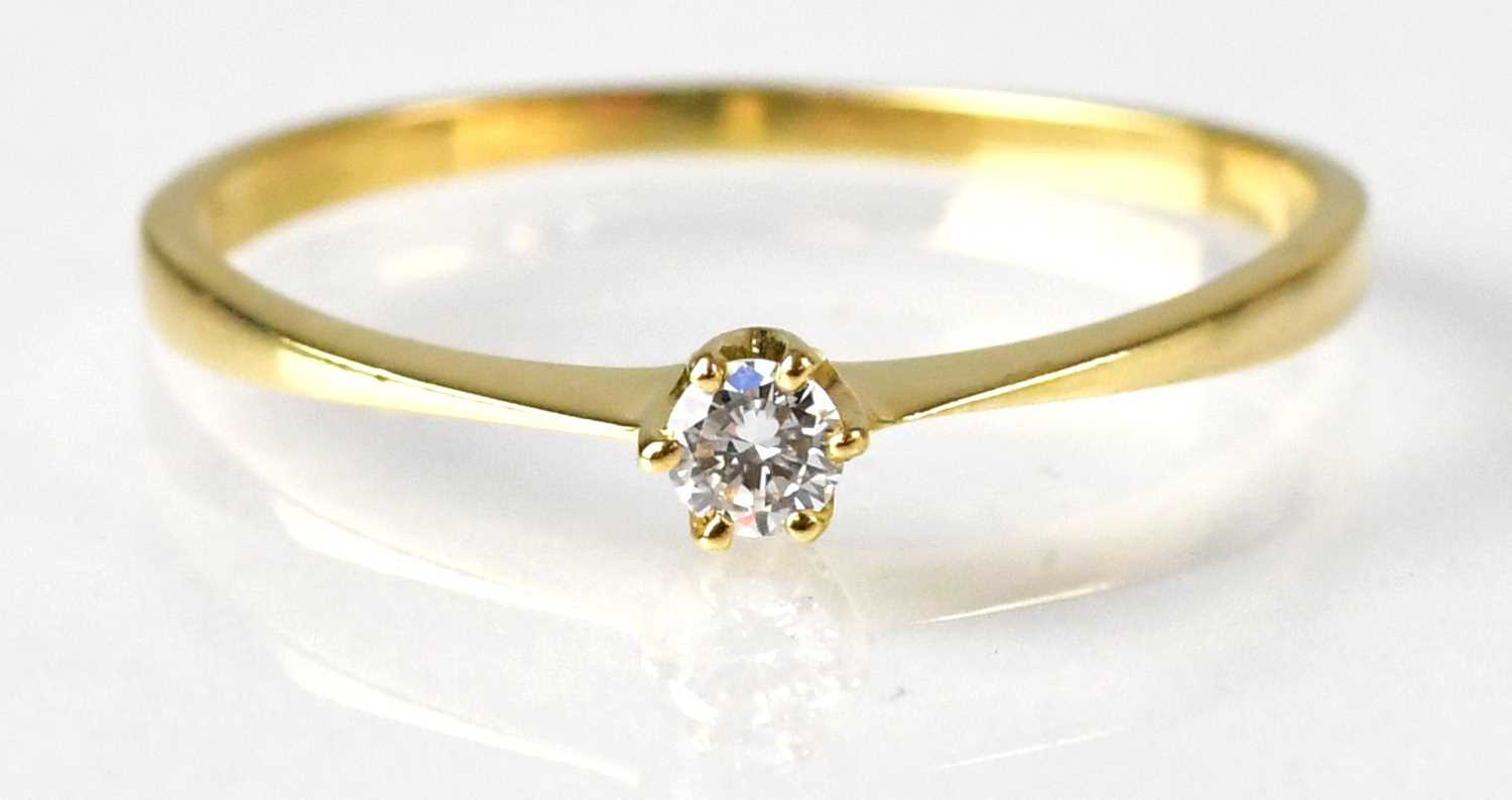 An 18ct yellow gold diamond solitaire ring, size P, approx. 1.2g. Condition Report: - Shank