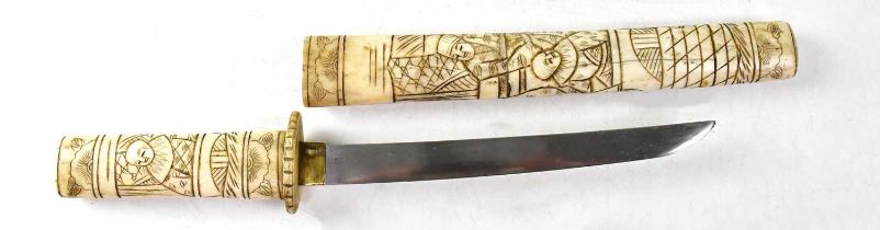 A early 20th century Japanese bone-handled Tanto, with 19cm fullered blade and carved bone scabbard,