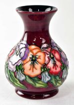 MOORCROFT; a vase decorated with pansies, copyrighted for 1993, with impressed and painted marks