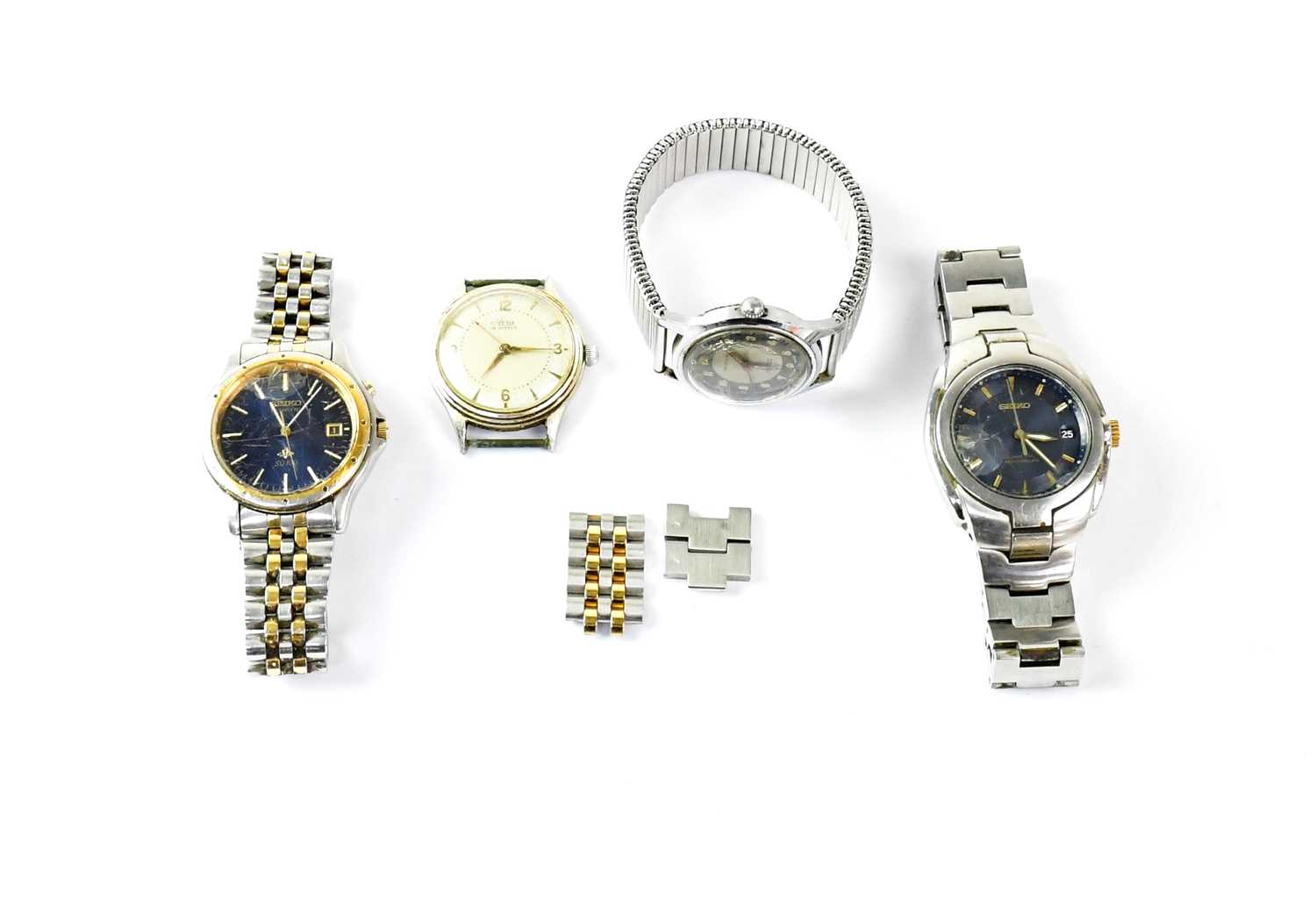 Four various wristwatches comprising a Seiko Kinetic SQ100, an Arcadia waterproof and shock