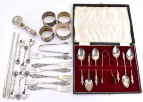 Mixed silver items comprising a cased set of six apostle teaspoons with sugar tongs, four various