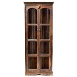A Colonial-style dark stained two-door food cabinet, each door with arched panel and barred doors,