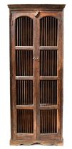 A Colonial-style dark stained two-door food cabinet, each door with arched panel and barred doors,