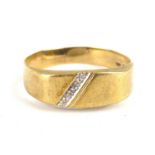 A 9ct gold band ring with flat table and diagonal diamond set line, size X, approx. 2.2g.