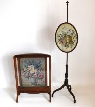 An Edwardian adjustable pole screen with oval floral tapestry, raised on splayed feet, 150 x 43 x