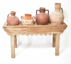 A 19th century pine four-section amphora stand with shaped apron supports, 58 x 120 x 36cm.