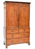 A George III mahogany linen press with dentil moulding, converted to a wardrobe (therefore lacking