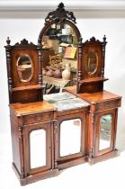 A Victorian inlaid mahogany mirror back sideboard with arched triple mirror top above a partial