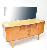 AUSTIN SUITE; a mid-20th century teak dressing table with rectangular mirror above a base of three