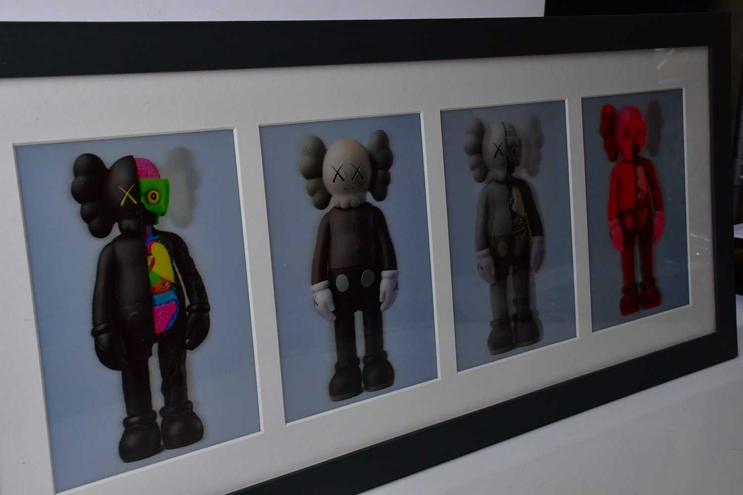 KAWS (AMERICAN, born 1974); 'Companion Flayed' (lenticular postcards set of four), black, brown, - Image 3 of 4