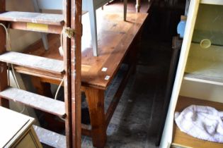 An old pitch pine refectory dining table on block legs, width 156cm, depth 78cm, height 83cm.