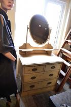 An old pine mirror back dressing chest of two short over two long drawers, on plinth base, width