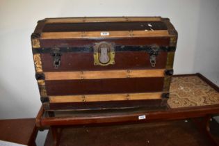 Two vintage metal bound dome topped travelling trunks (2).