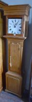 A 19th century pine cased longcase clock, the painted dial set with Roman numerals, the pine case