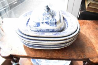 Nineteen 19th century ironstone meat plates of various sizes, in the 'Willow' pattern, together with