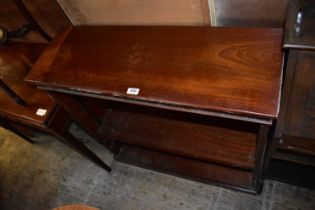 A reproduction mahogany dwarf open fronted bookcase with single adjustable shelf, on plinth base,