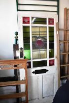 A vintage door with leaded glazed and stained glass panels, height 196cm, width 83cm.