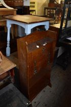 An early 20th century oak student's bureau, together with a modern pub table (2).