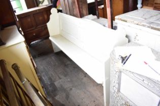 A Victorian painted pine church pew, width 183cm.