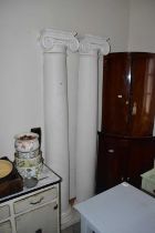 A pair of composite Ionic columns, height 310cm.