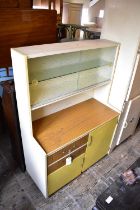 A 1950s painted wood kitchenette with an arrangement of doors and drawers, together with a 1950s