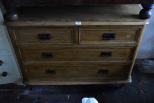 An old pine chest of two short over two long drawers, width 110cm, depth 50cm, height 85cm.