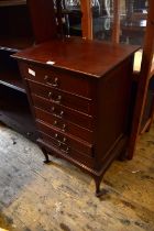 An Edwardian inlaid mahogany music chest of six drawers on cabriole supports, height 86cm, width