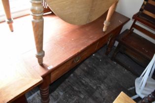 An old pine farmhouse kitchen table with two dummy drawers, on turned column supports, width