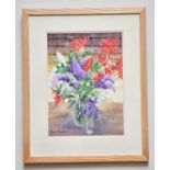 † JUNE BEVAN; watercolour, 'Lilac and Crocosmia', signed lower left, 37 x 26cm, framed and glazed.